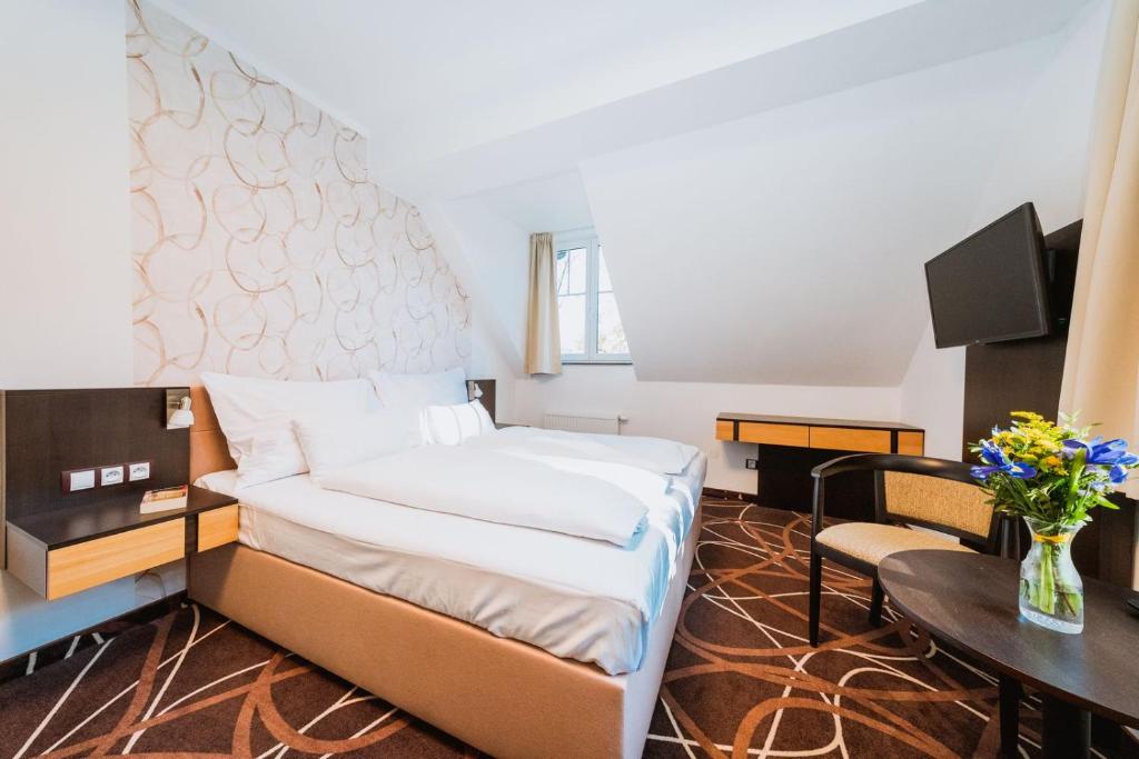 TV a/nebo společenská místnost v ubytování Hotel Hubertus