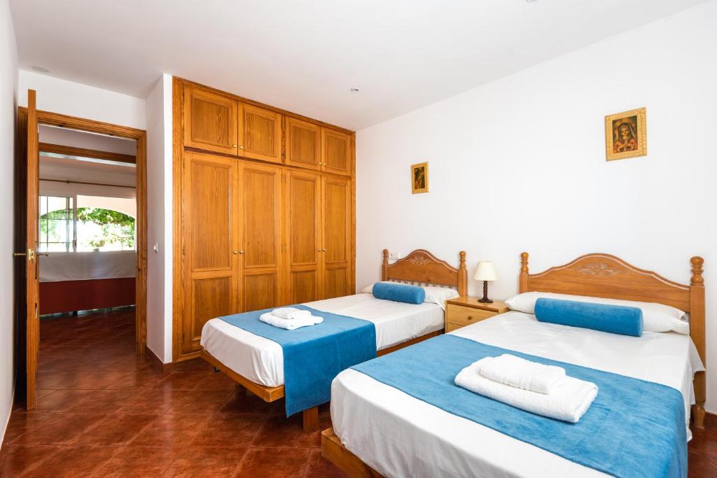 Postel nebo postele na pokoji v ubytování Villa Xiscu by Mauter Villas