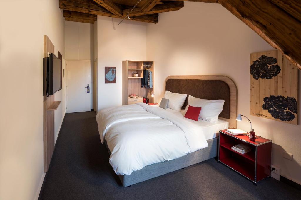 Postel nebo postele na pokoji v ubytování KONCEPT HOTEL Löie