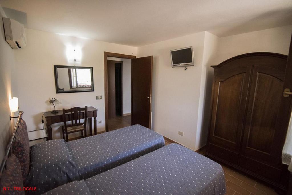 Łóżko lub łóżka w pokoju w obiekcie La casa di Carla