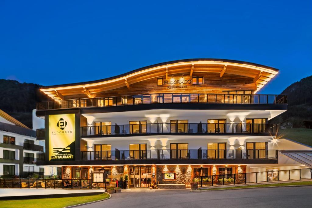 a large building with a large clock on the front of it at Hotel Eldorado in Ischgl