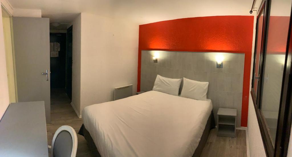 Postel nebo postele na pokoji v ubytování Hôtel Le Forestia
