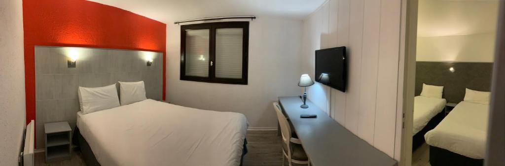 Postel nebo postele na pokoji v ubytování Hôtel Le Forestia