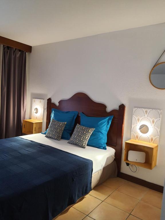 Postel nebo postele na pokoji v ubytování Mon Pti Nid - Havre cosy avec vue tropicale en Martinique