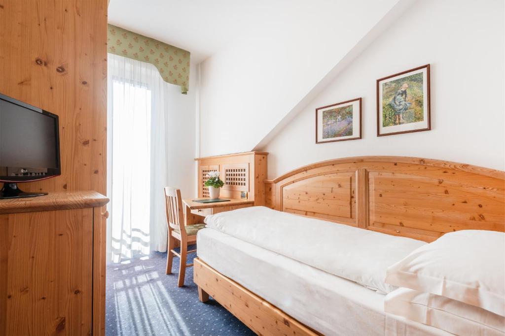 Postel nebo postele na pokoji v ubytování Hotel Lucia
