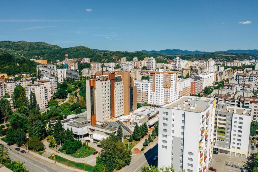 an aerial view of a city with tall buildings at Grand Hotel Tuzla in Tuzla