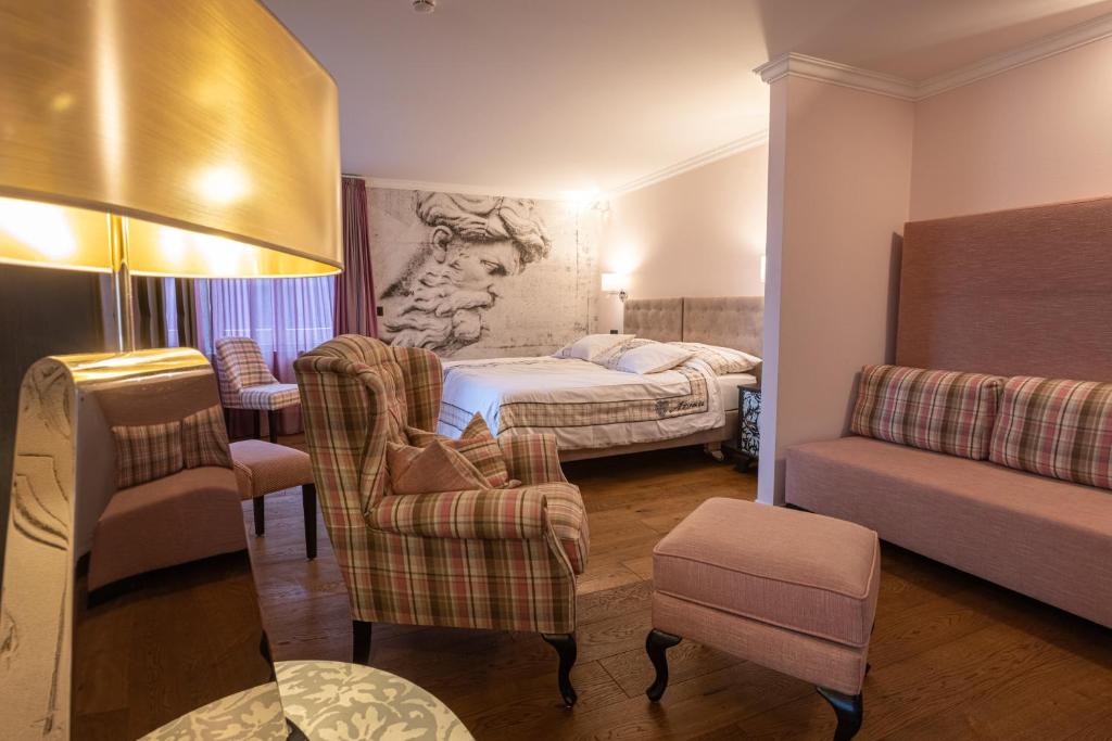 Postel nebo postele na pokoji v ubytování Home Hotel Arosa