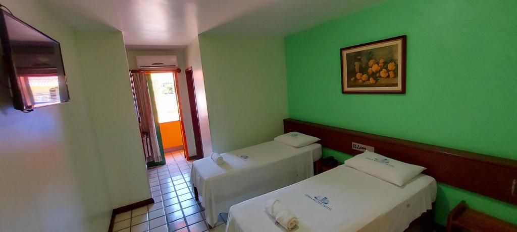 Postel nebo postele na pokoji v ubytování Hotel Terra Mater