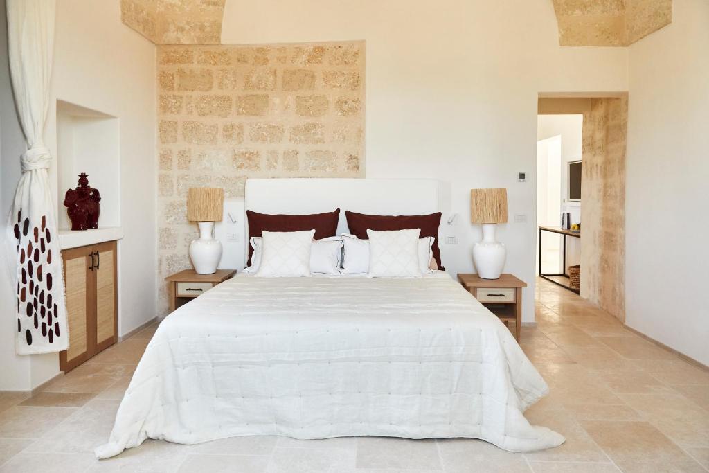 Postel nebo postele na pokoji v ubytování Masseria Calderisi