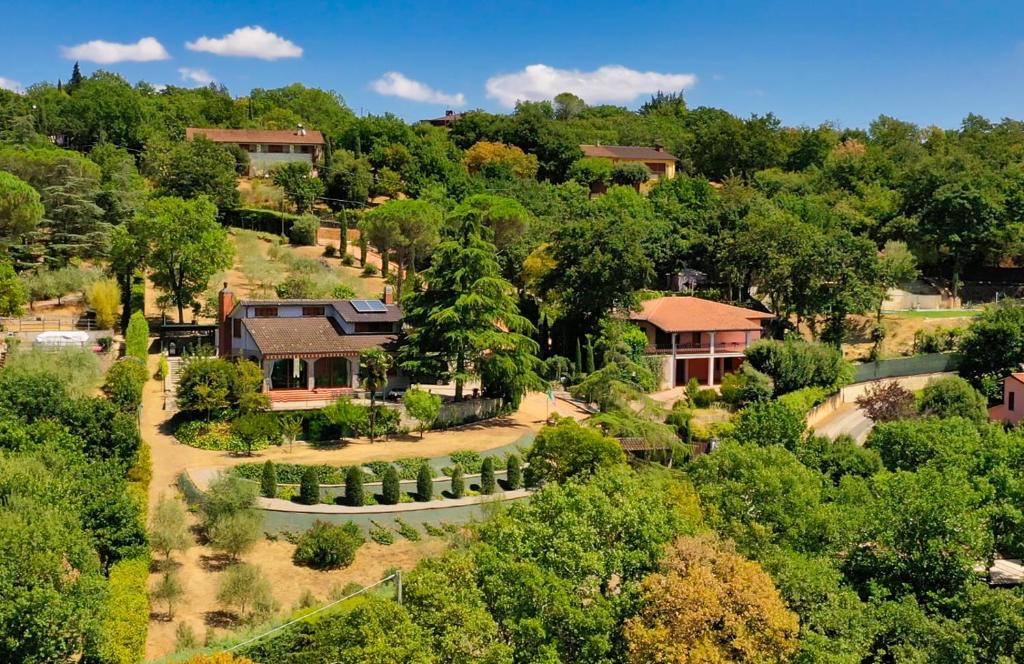 an aerial view of a house in a forest at Casa dei Tramonti in San Feliciano