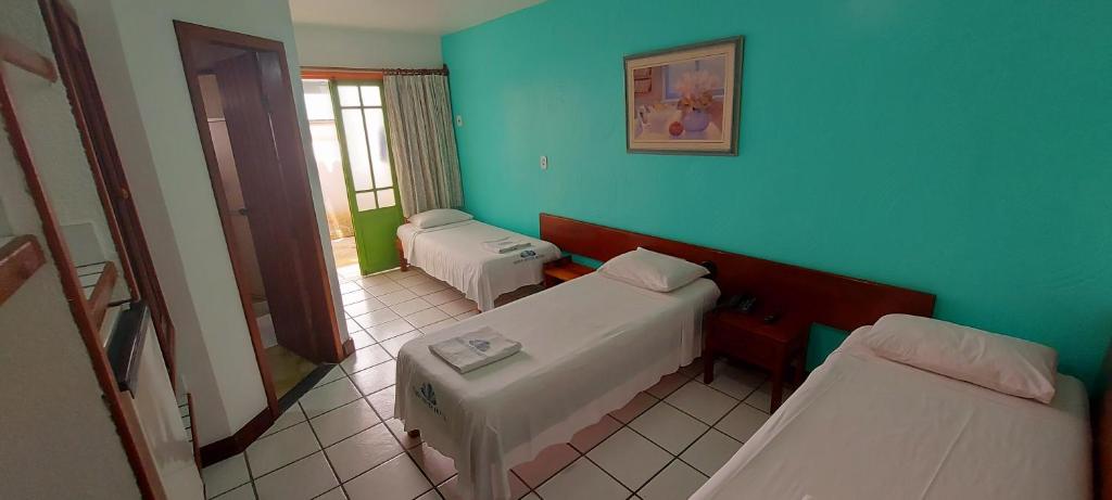Postel nebo postele na pokoji v ubytování Hotel Terra Mater