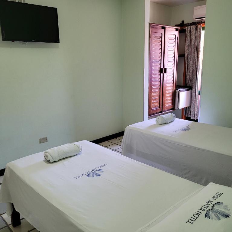 Postel nebo postele na pokoji v ubytování Hotel Terra Mater