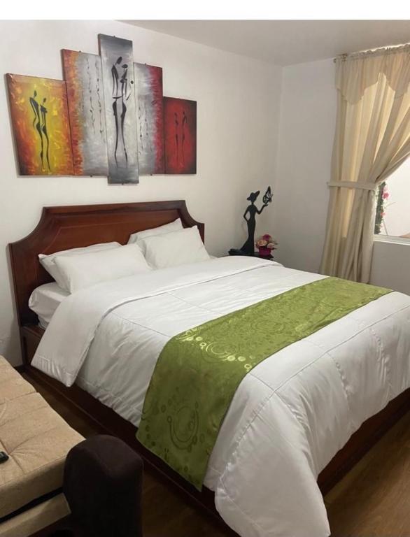 Postel nebo postele na pokoji v ubytování Loreto hotel