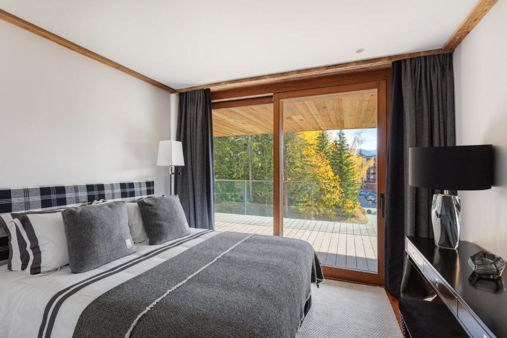 Postel nebo postele na pokoji v ubytování Sport Club Residences & Spa