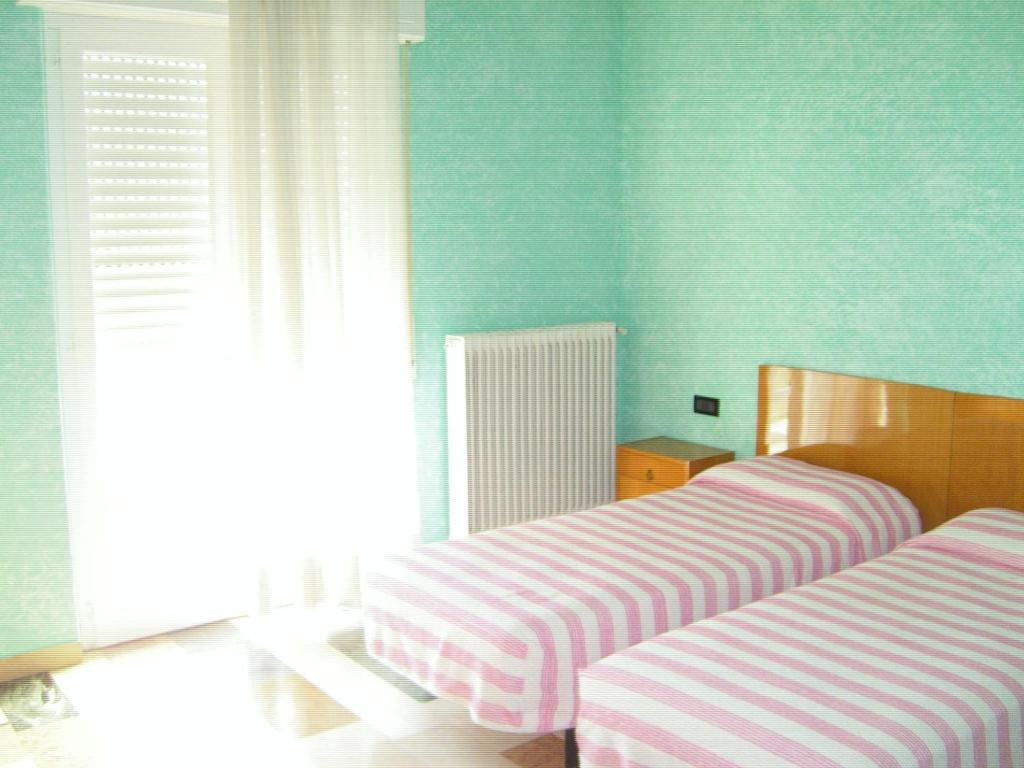Voodi või voodid majutusasutuse Albergo Drena toas