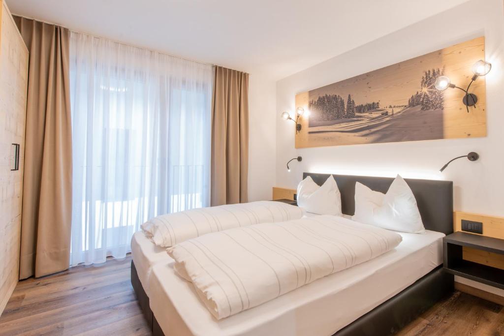 Postel nebo postele na pokoji v ubytování CHALET NORA