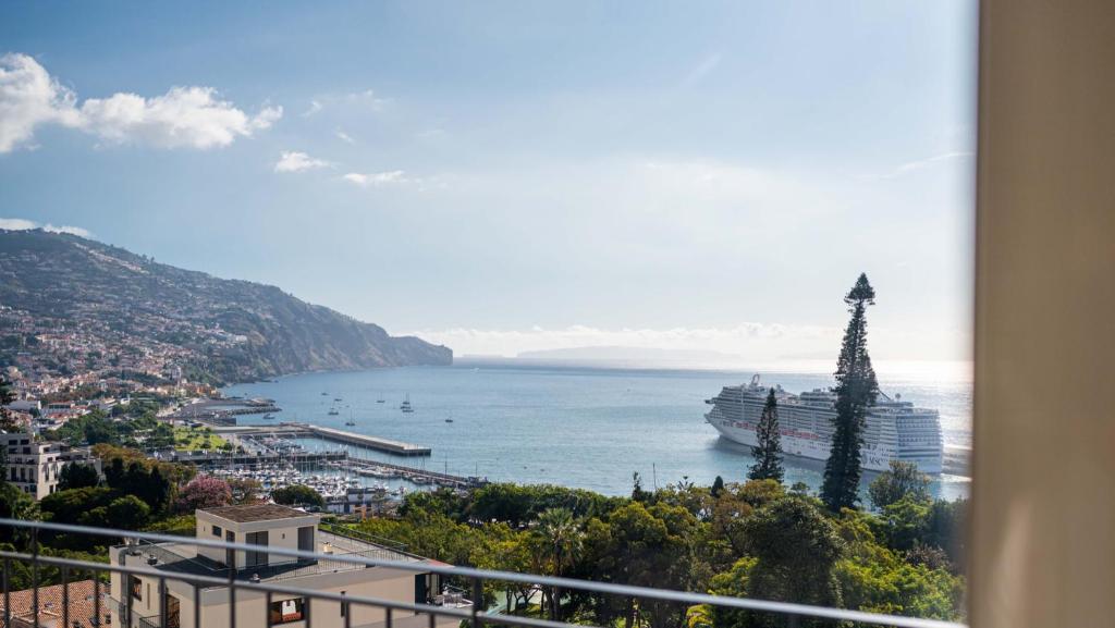 a view of the ocean and a cruise ship at Rooftop Funchal II by Madeira Best Apartments in Funchal