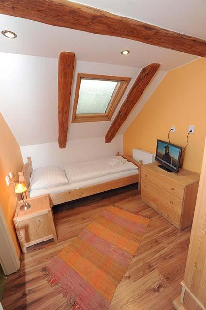 Postel nebo postele na pokoji v ubytování Garni Hotel St Anna