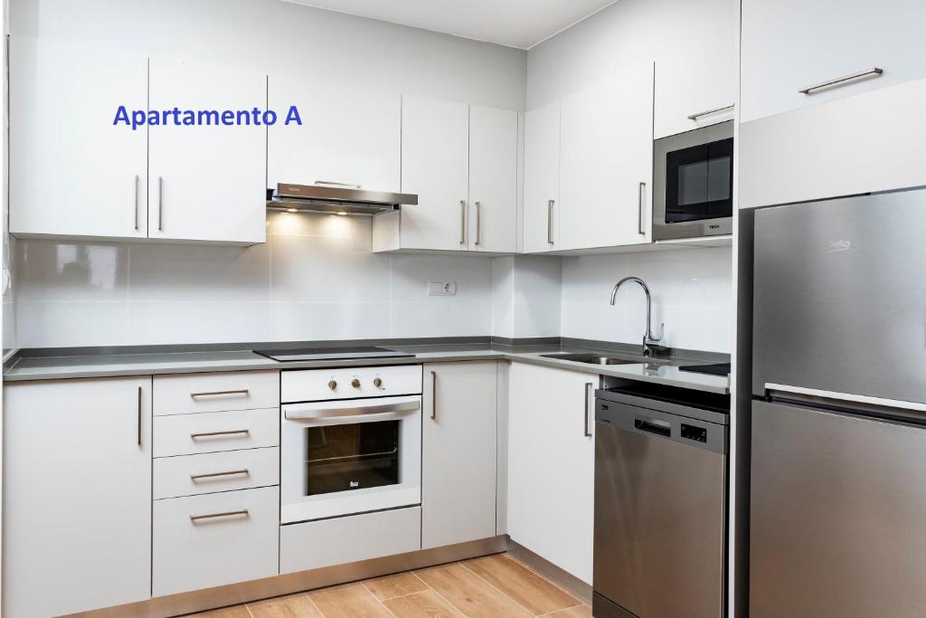 A kitchen or kitchenette at Sitges Rustic Apartments