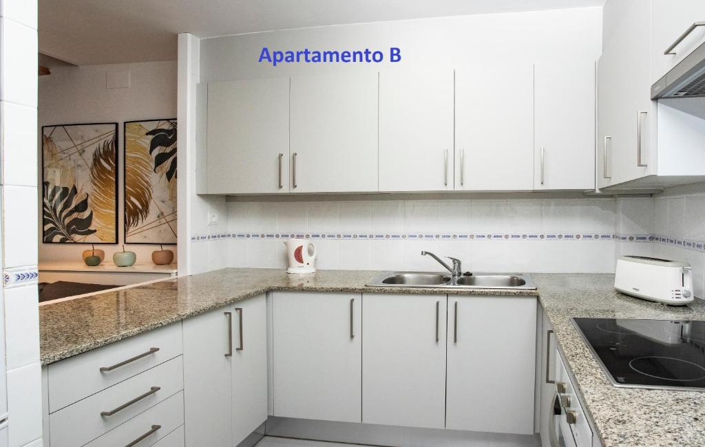 A kitchen or kitchenette at Sitges Rustic Apartments