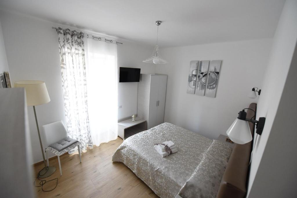 Postel nebo postele na pokoji v ubytování BeB Pignatelli Affittacamere