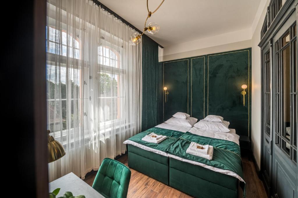 Postel nebo postele na pokoji v ubytování Apartamenty Wysoki Poziom