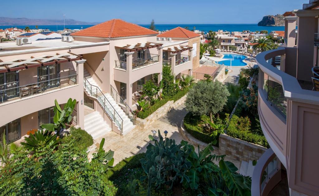 arial view of a villa with the ocean in the background at Isida Hotel Agia Marina in Agia Marina Nea Kydonias