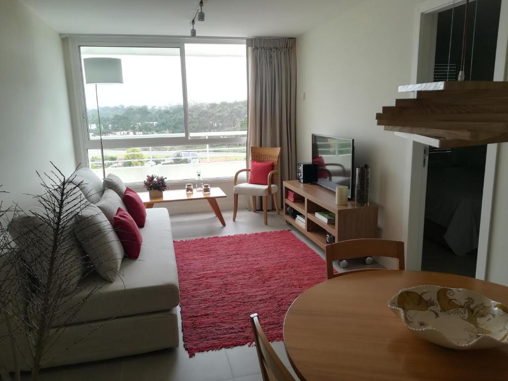 Televiisor ja/või meelelahutuskeskus majutusasutuses Apartamento Punta del Este