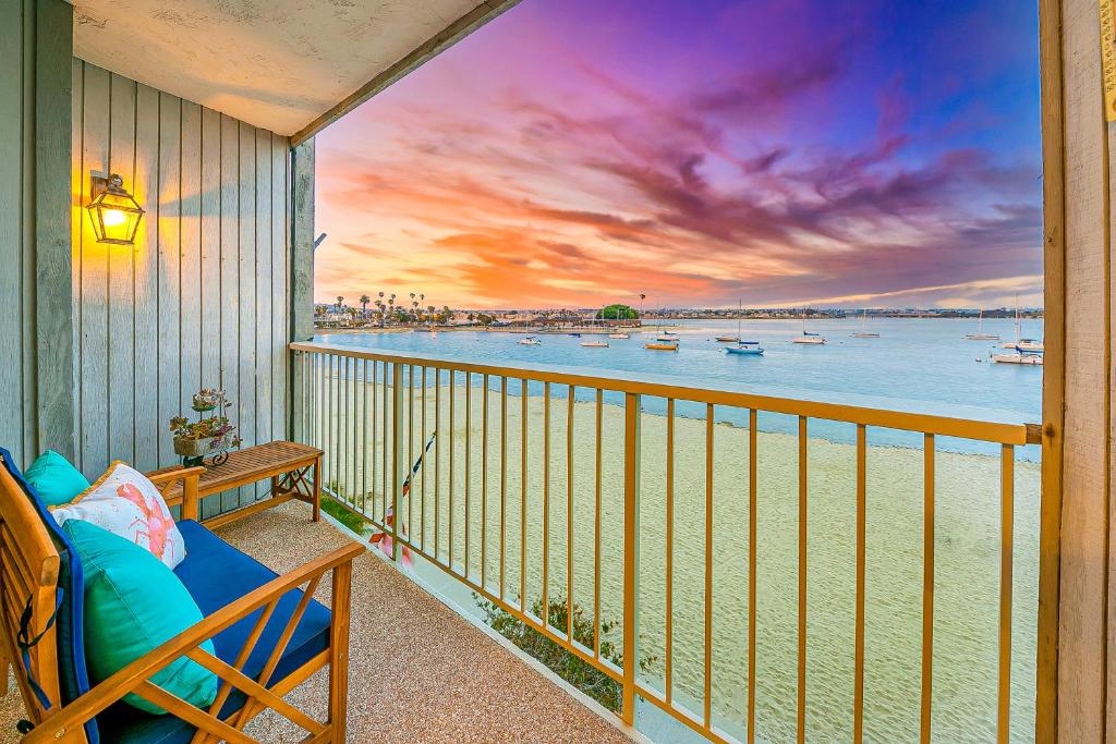 a balcony with a view of the water and boats at TV-384 Winery Row View in Temecula