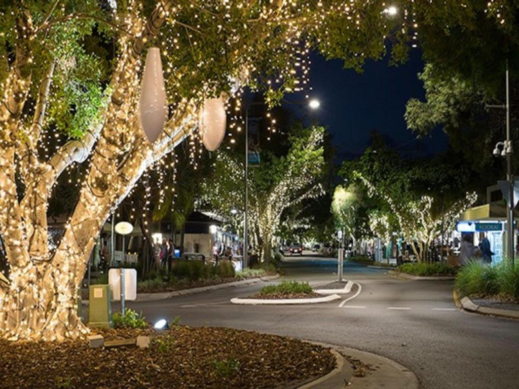 a street at night with lights on trees at Kareela Court 3 Kareela Avenue 14 in Noosa Heads