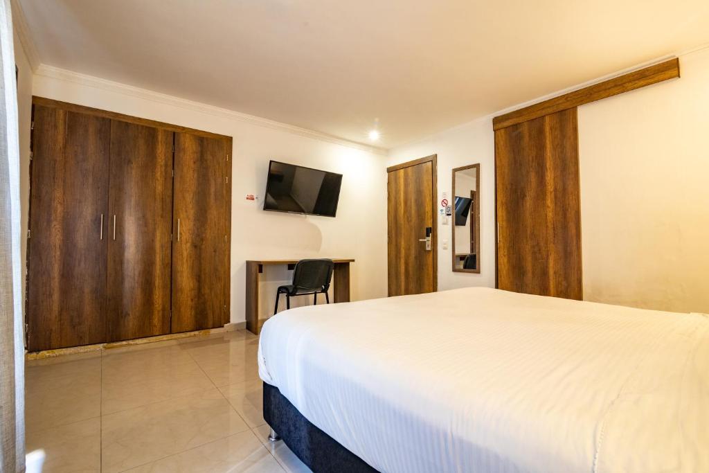 Postel nebo postele na pokoji v ubytování Hotel Amoek