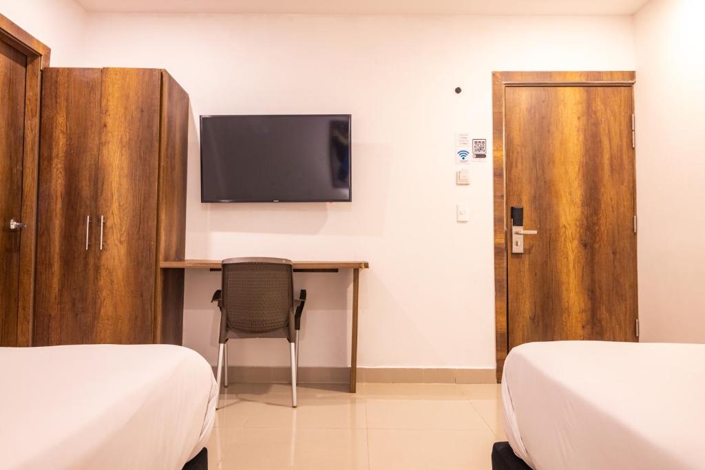 TV a/nebo společenská místnost v ubytování Hotel Amoek