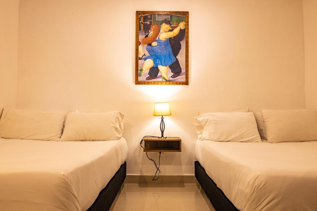 Postel nebo postele na pokoji v ubytování Hotel Amoek