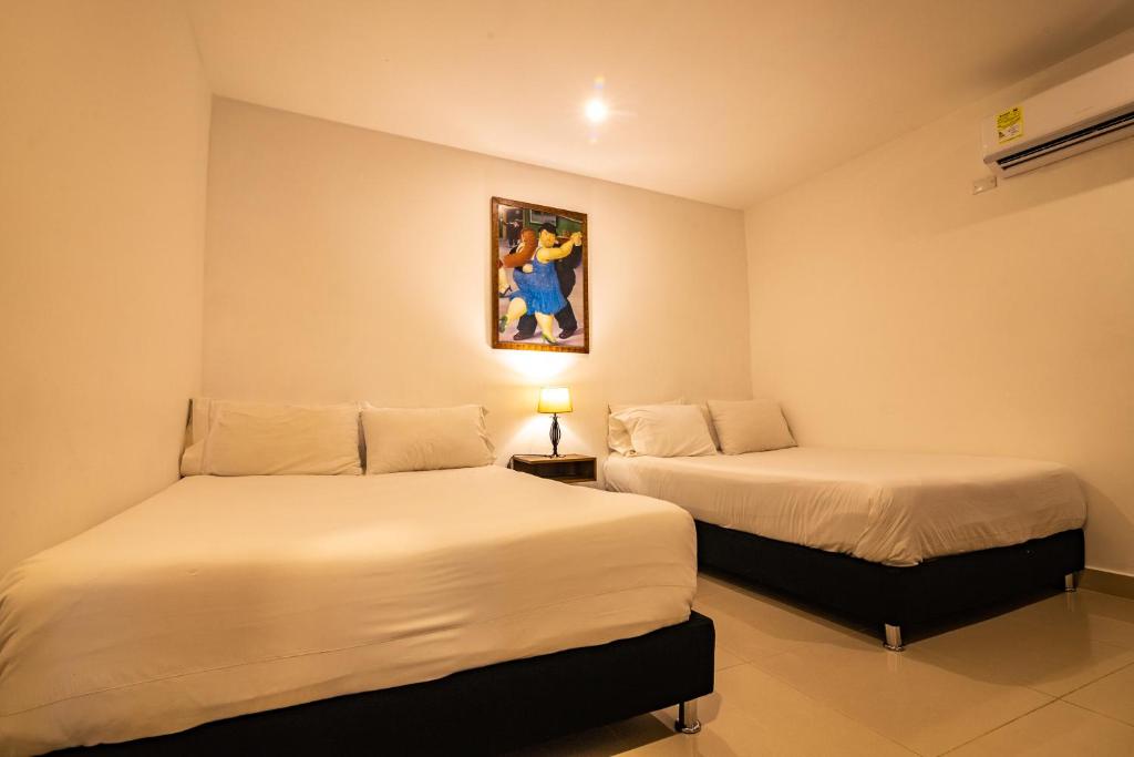 Postel nebo postele na pokoji v ubytování Hotel Amoek