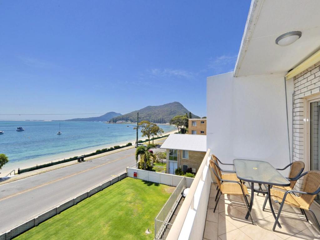 a balcony with a view of the ocean at Del Rae Unit 12 25 Shoal Bay Road in Shoal Bay