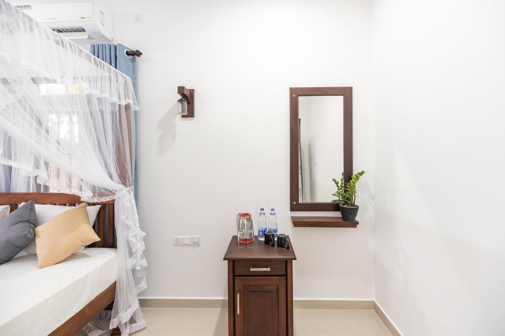 Postel nebo postele na pokoji v ubytování Hotel Calm Haven Unawatuna