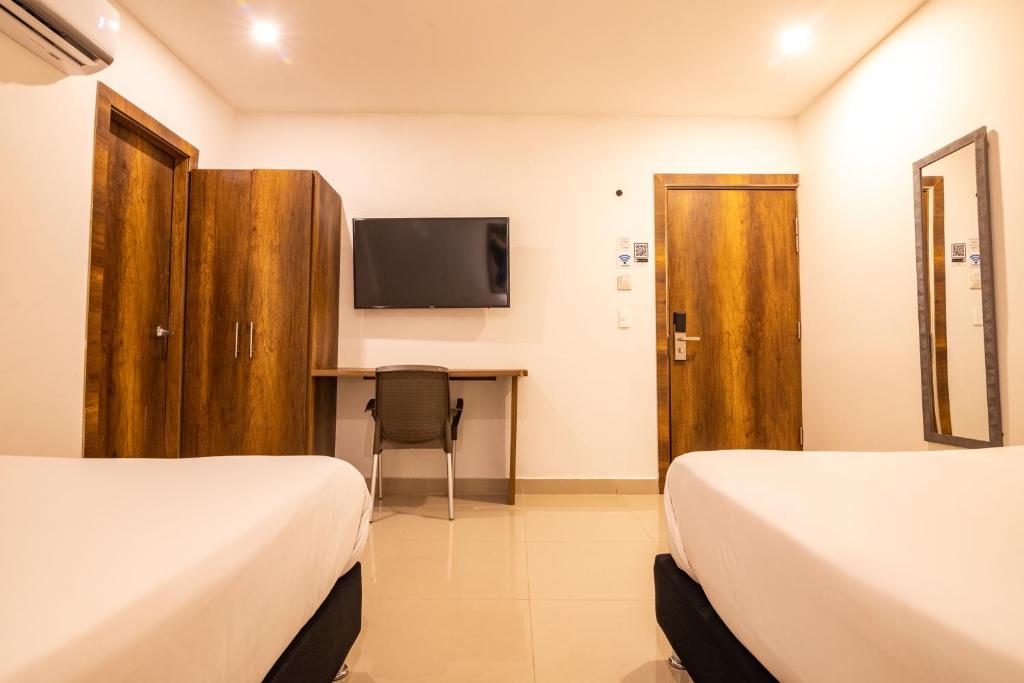 TV a/nebo společenská místnost v ubytování Hotel Amoek