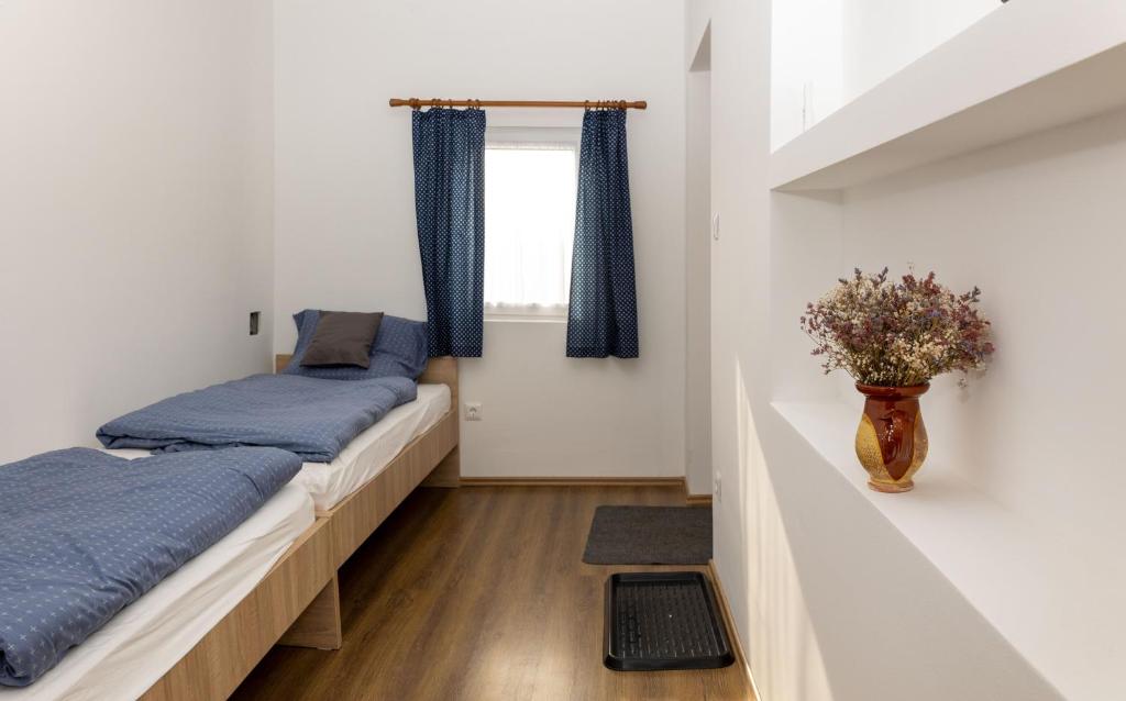 Postel nebo postele na pokoji v ubytování Takács Pince apartman