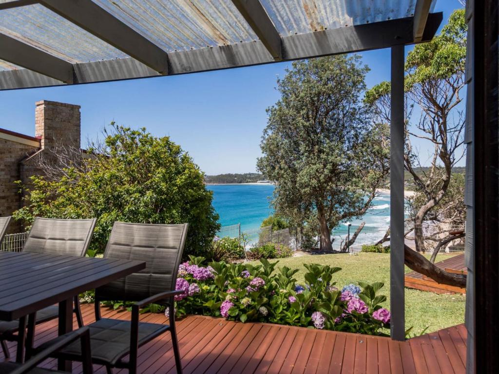 a view of the ocean from the deck of a house at Ocean Views in Mollymook