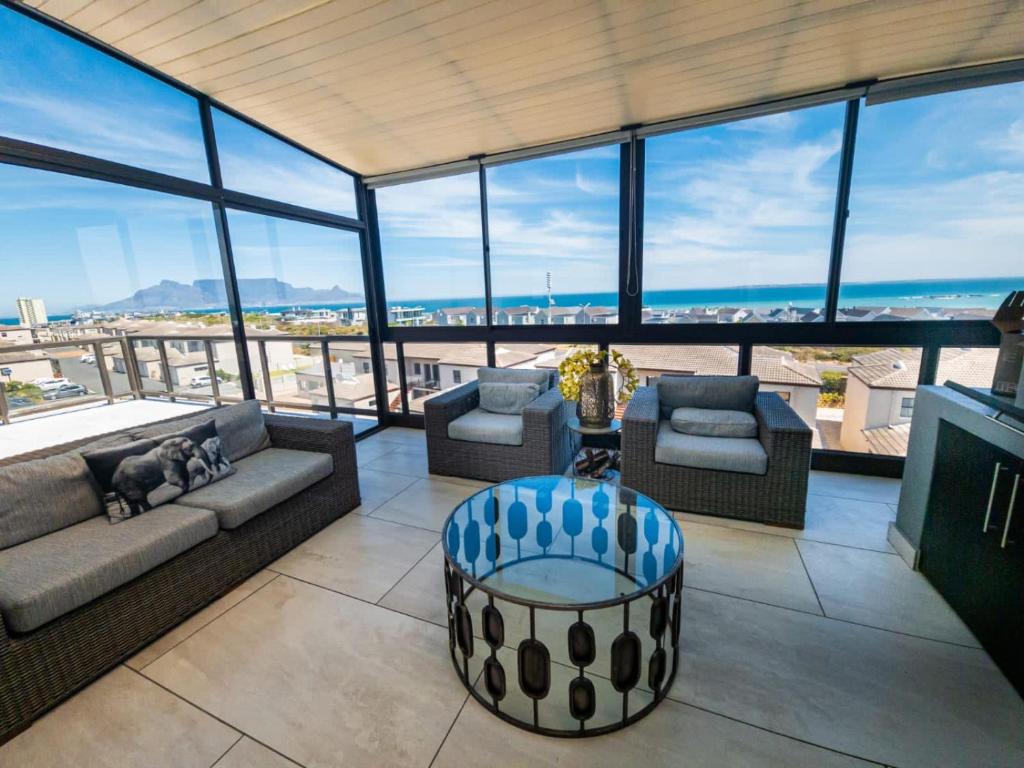 a living room with a view of the ocean at Waves Edge CP3 in Cape Town