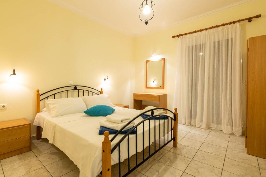 Posteľ alebo postele v izbe v ubytovaní Lenna's Villas Zante