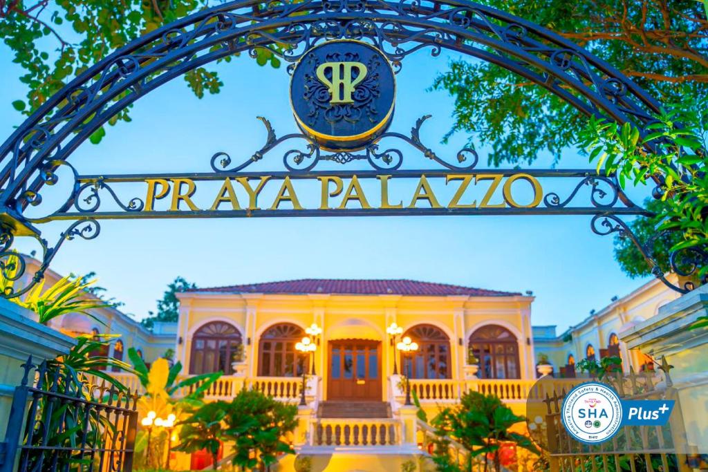 
a building with a clock on the front of it at Praya Palazzo - SHA Plus in Bangkok
