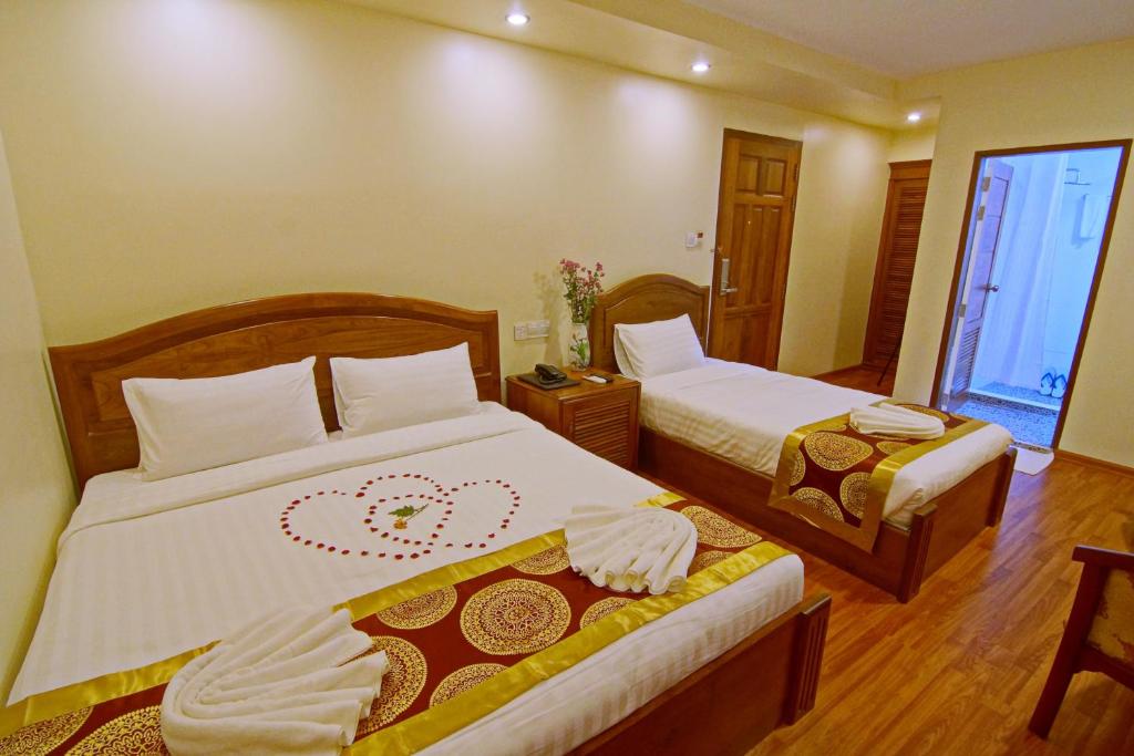 Letto o letti in una camera di Royal Pearl Hotel