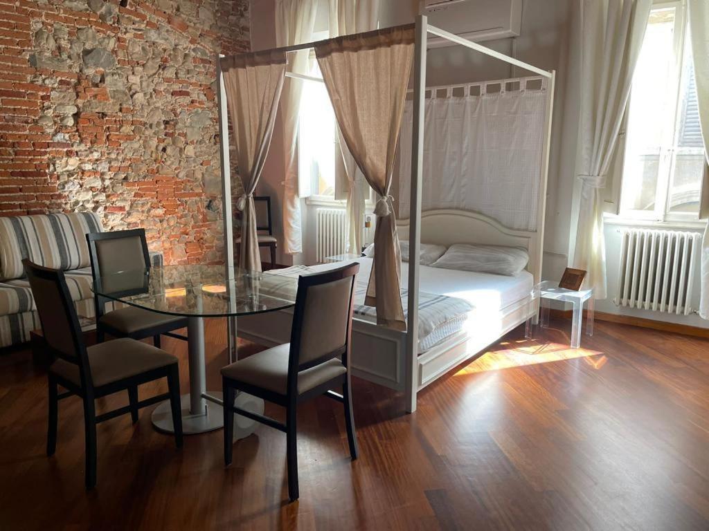 Posteľ alebo postele v izbe v ubytovaní Sant'Ambrogio Suite