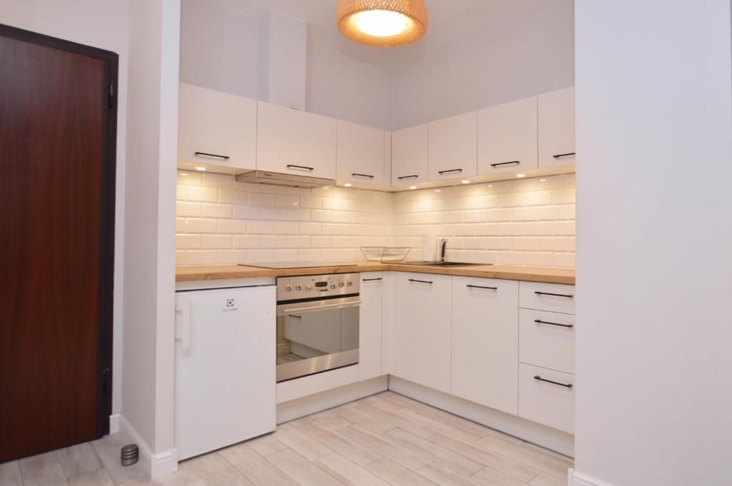 Dapur atau dapur kecil di Victus Apartamenty, Apartament Sunny