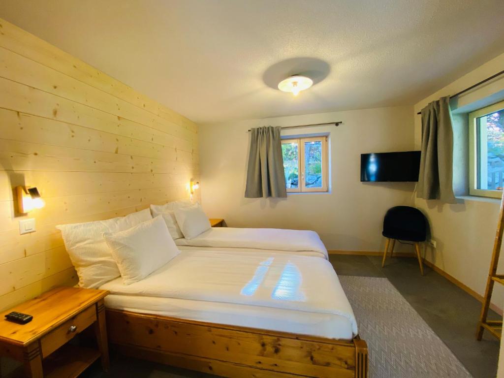 Postel nebo postele na pokoji v ubytování Chalet Bergheimat Zermatt