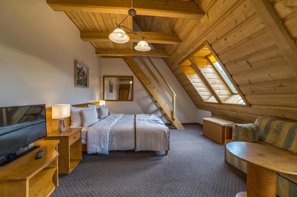 Posteľ alebo postele v izbe v ubytovaní Hotel Nosalowy Dwór