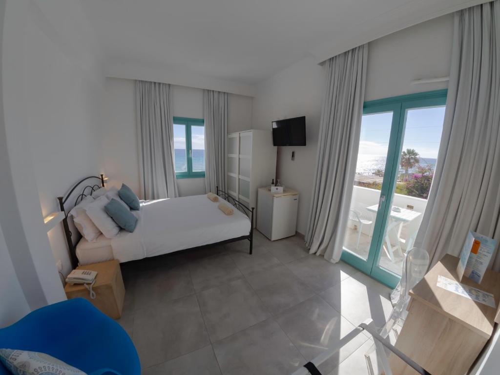 Postel nebo postele na pokoji v ubytování Amaryllis Beach Hotel