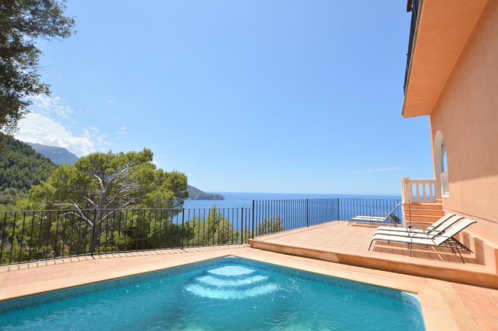 a swimming pool with a view of the water at Alconasser 10 - Amazing Seaviews between Deia & Soller in Sóller