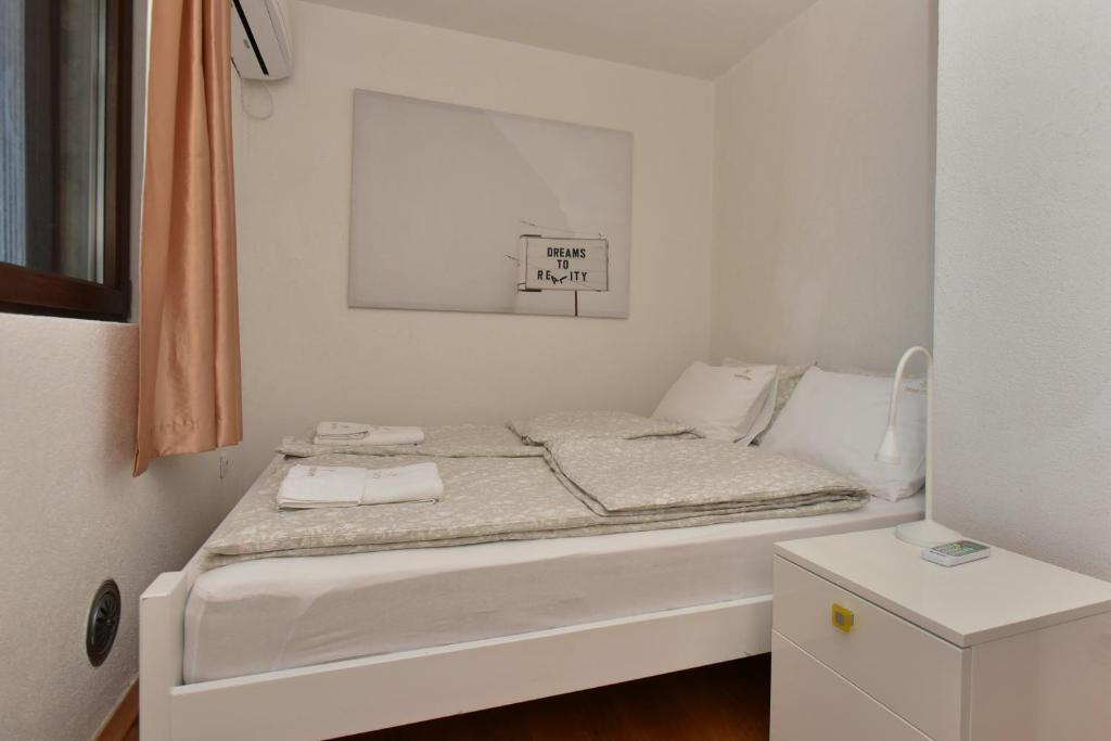 Postel nebo postele na pokoji v ubytování Villa Ariel